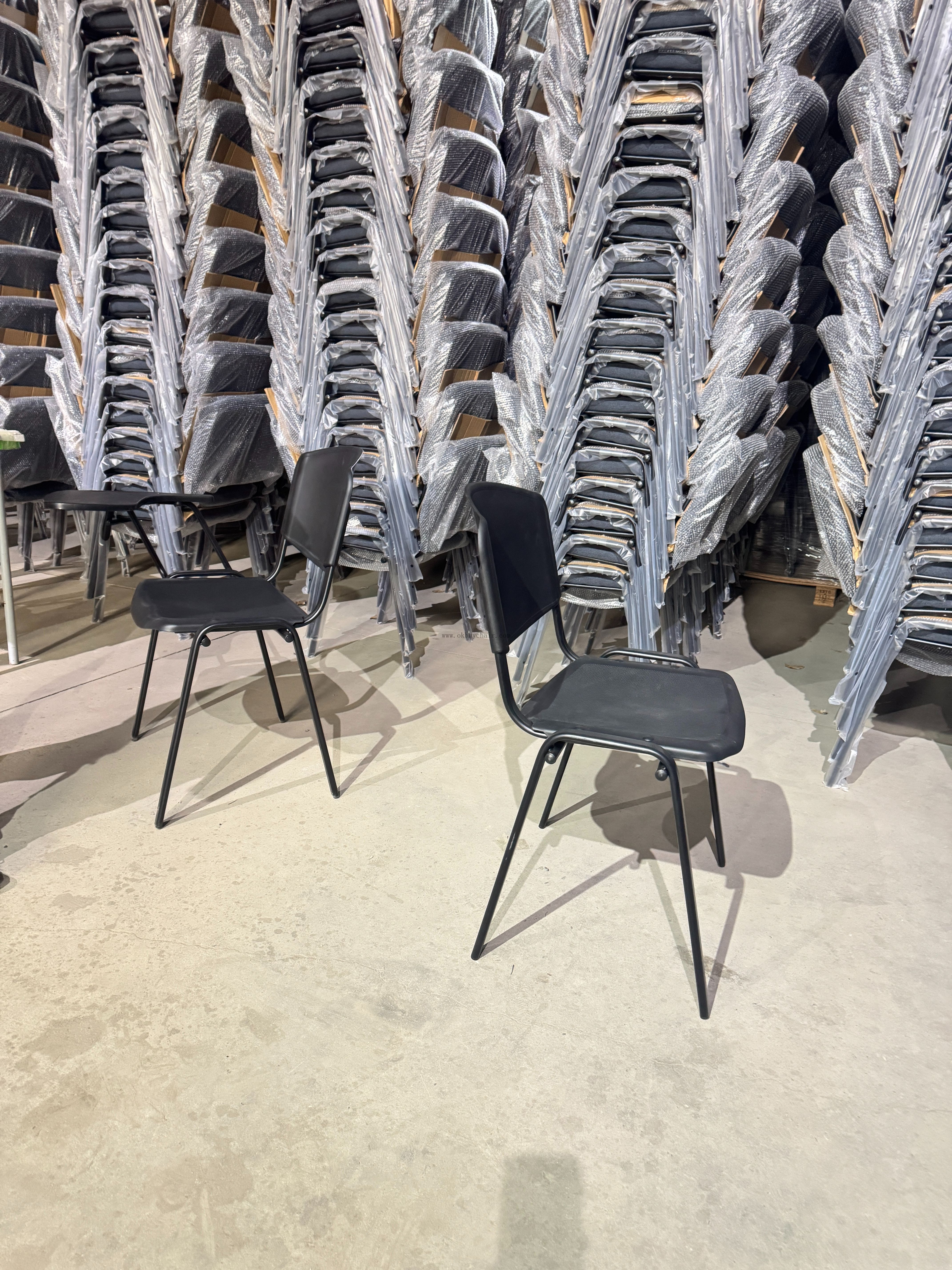 Close-up detail of the OK-510 chair seat texture and metal frame integration